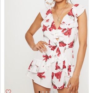 PrettyLittleThing floral romper with ruffles